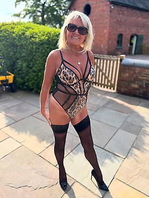 sexy old lady in stockings outside